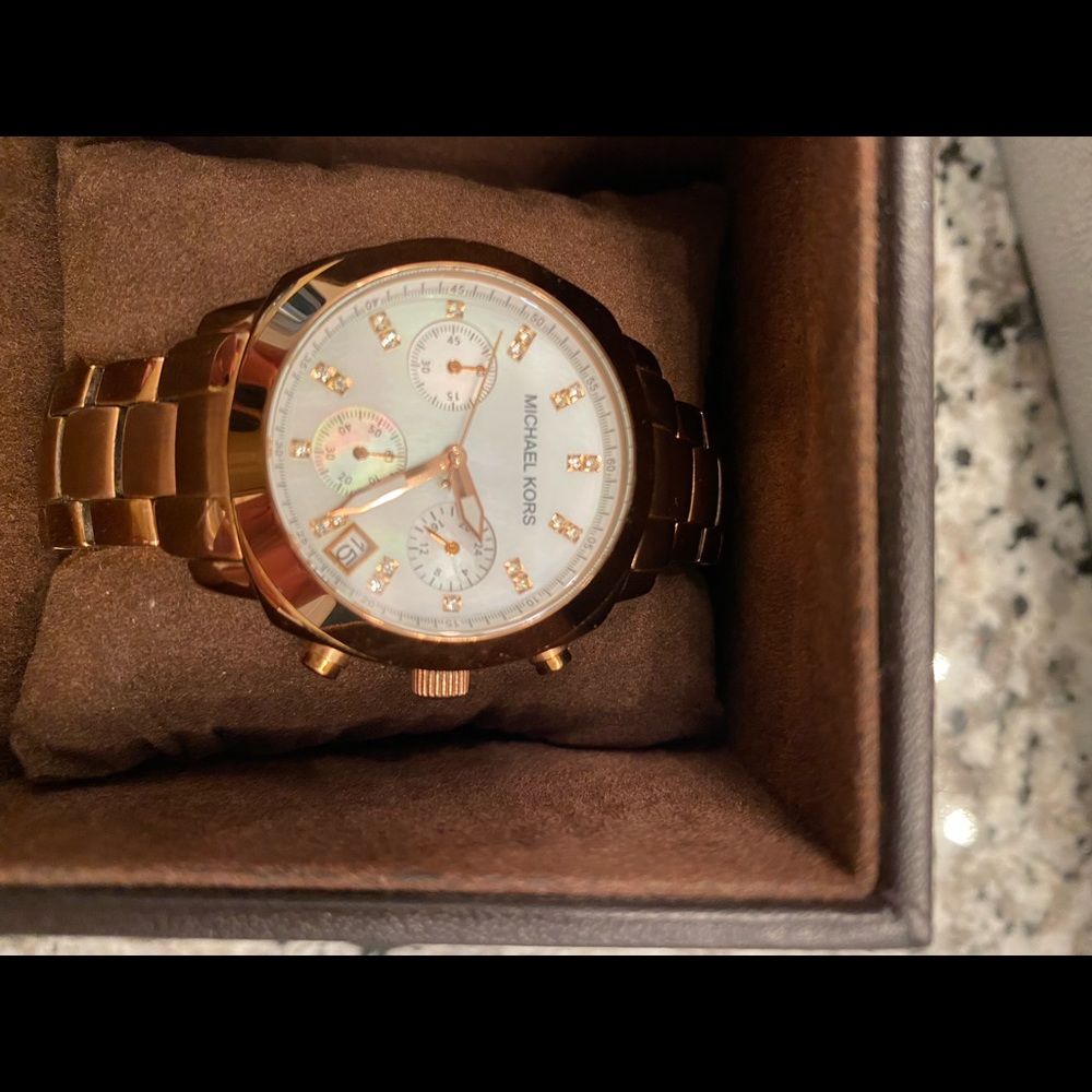 Michael Kors ladies rose gold watch with mother of pearl face
